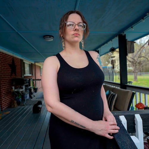 Stormy Bost stands on her porch in Calhoun, Ga., on March 29, 2026. (Miguel Martinez/Atlanta Journal-Constitution via AP)