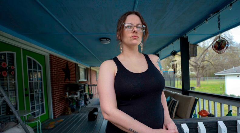 Stormy Bost stands on her porch in Calhoun, Ga., on March 29, 2026. (Miguel Martinez/Atlanta Journal-Constitution via AP)