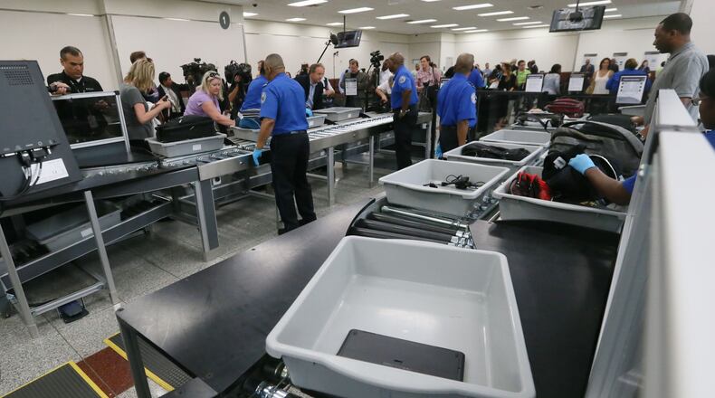 May 25, 2016 - Atlanta - Powered rollers transport bags automatically through the screening process. TSA unveiled new security "smart lanes" that have been installed in the South Security Checkpoint, which feature automated equipment that handles baggage. BOB ANDRES / BANDRES@AJC.COM