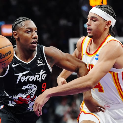 Toronto Raptors' RJ Barrett (9) drives past Atlanta Hawks' Asa Newell (14) during the first half of an NBA basketball game in Toronto, Saturday, Jan. 3, 2026. (Frank Gunn/The Canadian Press via AP)