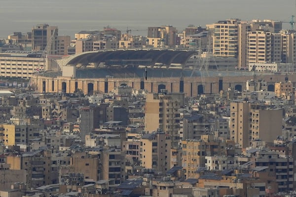A bomb dropped from an Israeli jet falls before hitting a building in Dahiyeh, in the southern suburb of Beirut, Lebanon, Friday, March 28, 2025. (AP Photo/Hassan Ammar)