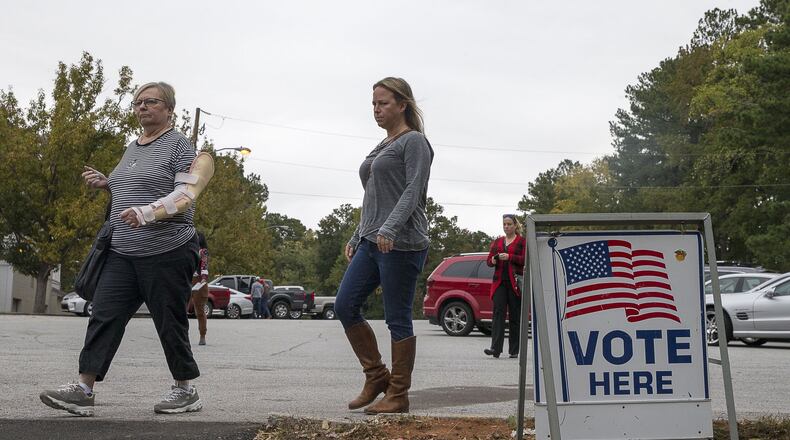 Voters prepare to cast their ballots at Campbell Middle School during Election Day in Smyrna, Tuesday, Nov. 5, 2019. This month’s elections were a chance for voters on a state purge list to be designated as active voters. (Alyssa Pointer/AJC)