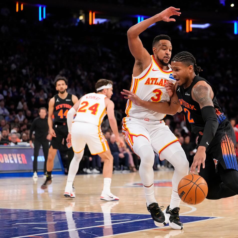 Knicks guard Miles McBride tries to drive past Hawks guard CJ McCollum during the first half of Game 2 of their first-round NBA playoff series on Monday, April 20, 2026, in New York. (Yuki Iwamura/AP)