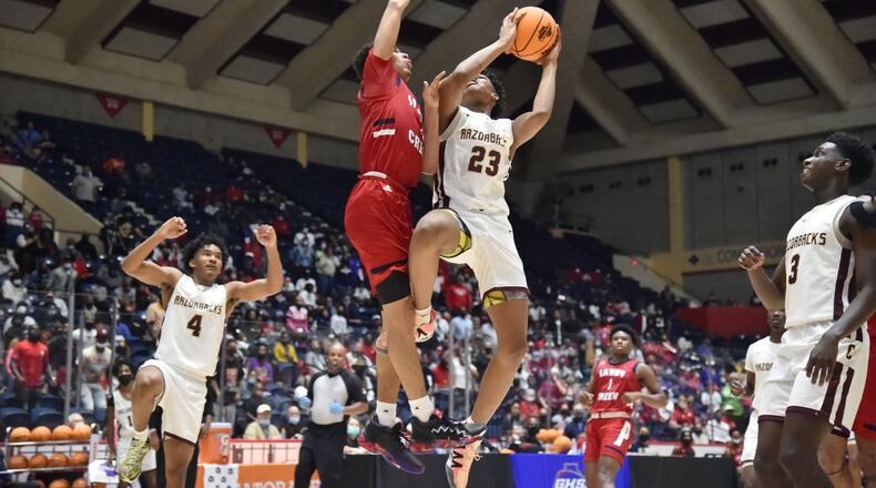 March 12, 2021 Macon - Cross Creek's Antoine Lorick (23) gets off a shot against Sandy Creek's Myles Rice (2) during the 2021 GHSA State Basketball Class AAA Boys Championship game at the Macon Centreplex in Macon on Friday, March 12, 2021 Cross Creek won 57-49 over Sandy Creek. (Hyosub Shin / Hyosub.Shin@ajc.com)