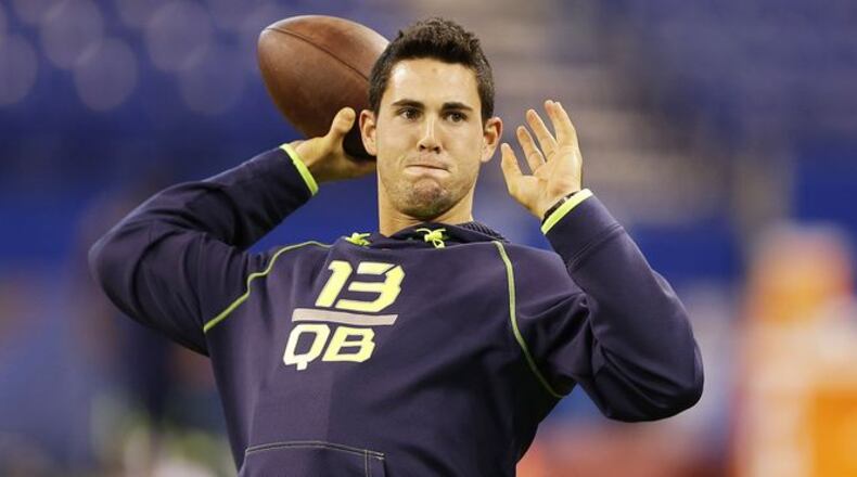 Georgia quarterback Aaron Murray throws during a drill at the NFL football scouting combine in Indianapolis, Sunday, Feb. 23, 2014. (AP Photo/Michael Conroy)