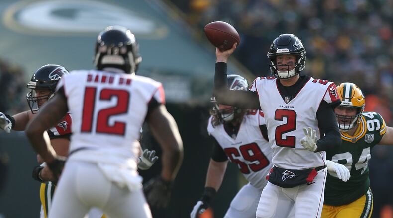 GREEN BAY, WISCONSIN - DECEMBER 09: Matt Ryan #2 of the Atlanta Falcons throws a pass to Mohamed Sanu #12 during the first half of a game against the Green Bay Packers at Lambeau Field on December 09, 2018 in Green Bay, Wisconsin. (Photo by Dylan Buell/Getty Images)