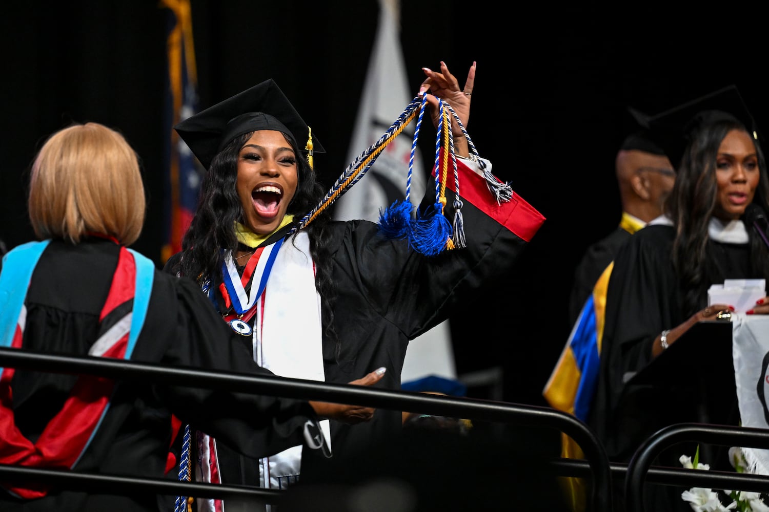 Iyamah Williams celebrates as she walks across the stage during Clark Atlanta University’s 2025 commencement ceremony Sunday, May 18, 2025 at Georgia State’s Convocation Center. (Daniel Varnado/For the Atlanta Journal-Constitution)