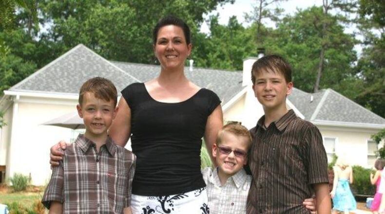 Griffin Prince, left, and Jake Prince died in a June 2012 boating wreck. They are shown with their mother, Tara, and older brother, Ryan. (File photo)