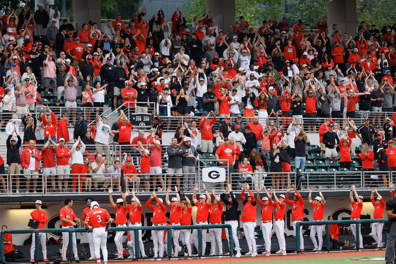 Georgia Bulldogs fans and players cheer as the Liberty Flames change pitchers during the eighth inning Sunday, May 31, 2026, in Athens. (Miguel Martinez/AJC)