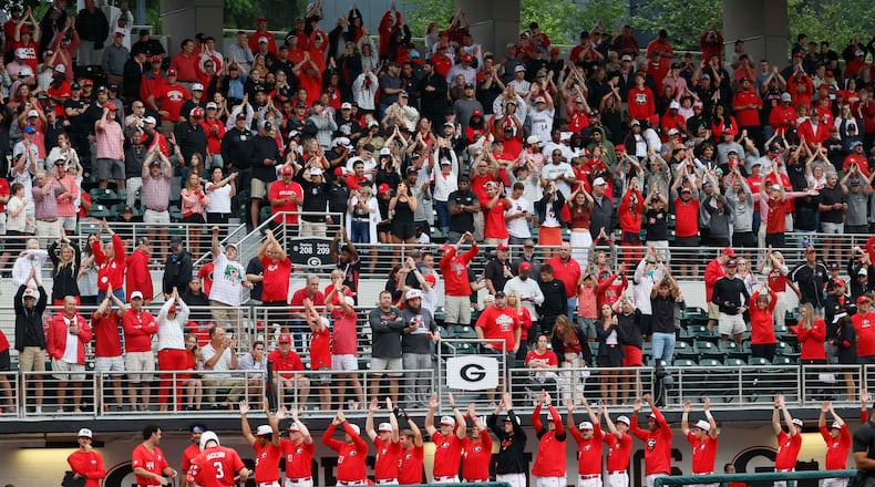 Georgia Bulldogs fans and players cheer as the Liberty Flames change pitchers during the eighth inning Sunday, May 31, 2026, in Athens. (Miguel Martinez/AJC)