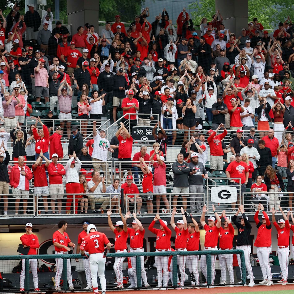 Georgia Bulldogs fans and players cheer as the Liberty Flames change pitchers during the eighth inning Sunday, May 31, 2026, in Athens. (Miguel Martinez/AJC)