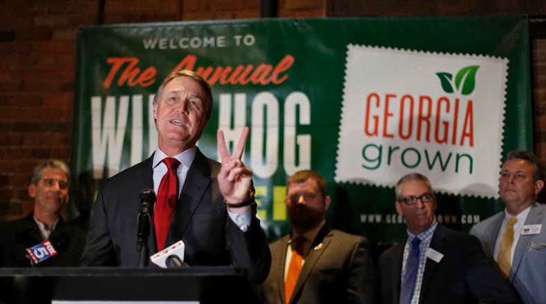 U.S. Sen. David Perdue addresses the 54th Annual Wild Hog Supper earlier this month. Bob Andres, bandres@ajc.com