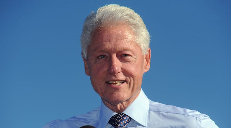 Former President Bill Clinton made an appearance at an early vote rally in Tampa, Fla., with Democratic candidate for governor Charlie Crist Sunday, Oct. 26, 2014. Clinton was in Florida Sunday campaigning for Democratic candidates in the up coming November elections. (AP Photo/The Tampa Tribune, Jim Reed) Former President Bill Clinton made an appearance at an early vote rally in Tampa, Fla., with Democratic candidate for governor Charlie Crist on Sunday. AP/The Tampa Tribune, Jim Reed)\