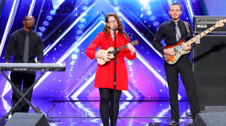 In this undated photo provided by NBC, Mandy Harvey sings during auditions for the show "America's Got Talent" in Pasadena, Calif. Harvey, a deaf singer is moving on to the semifinals of âAmericaâs Got Talentâ after delivering a performance that aired Tuesday, June 6, 2017, that judge Simon Cowell calls âone of the most amazing thingsâ heâs ever seen or heard. Mandy Harvey told the judges on the NBC reality competition that she suffers from a connective tissue disorder and she lost her hearing when she was 18. Now 29, Harvey said she taught herself to sing again using muscle memory and visual tuners. (Trae Patton/NBC via AP)