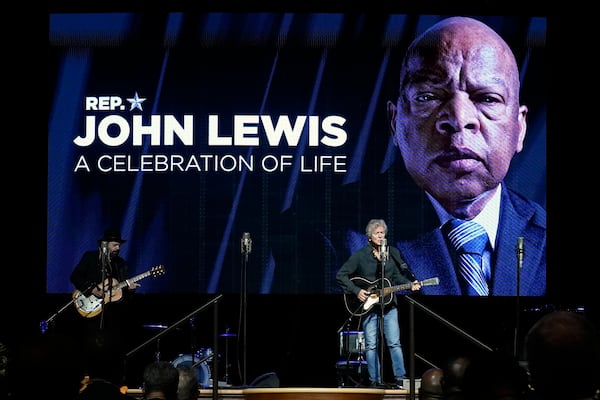 FILE - Rodney Crowell, right, performs in the Ryman Auditorium during a celebration of life marking the one-year anniversary of U.S. Rep. John Lewis's death, July 17, 2021, in Nashville, Tenn. (AP Photo/Mark Humphrey, file)