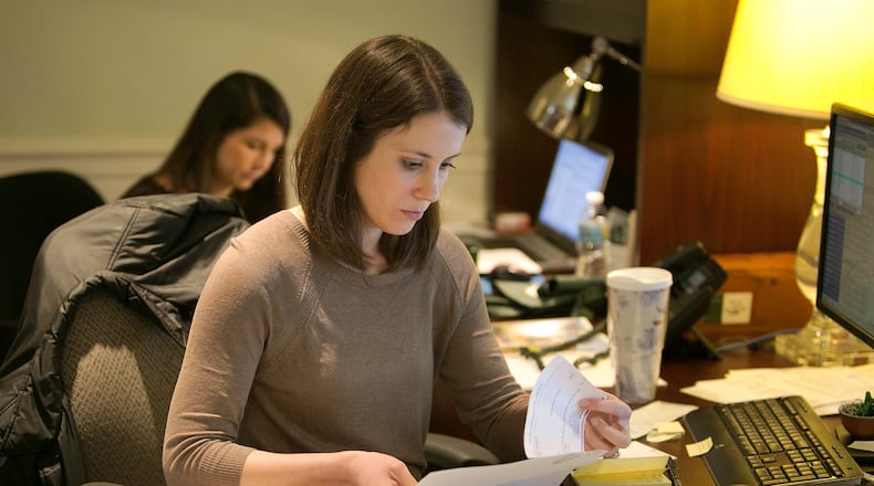 Kristen Bates (foreground) & Elizabeth King (both cq) process paperwork at the Dorsey Alston offices in Buckhead. The company has been voted the No 1 Top medium workplace in Atlanta. (Photo by Phil Skinner)