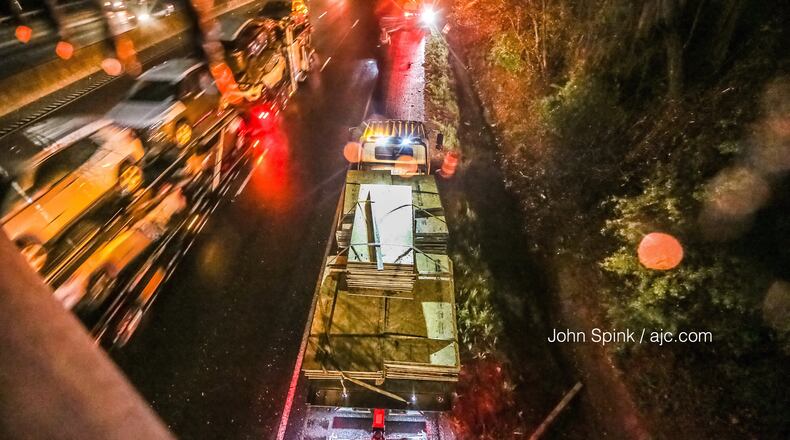 A man had visible burns after a fiery crash and fuel spill on I-285 West near Flat Shoals Road in DeKalb County, police said.