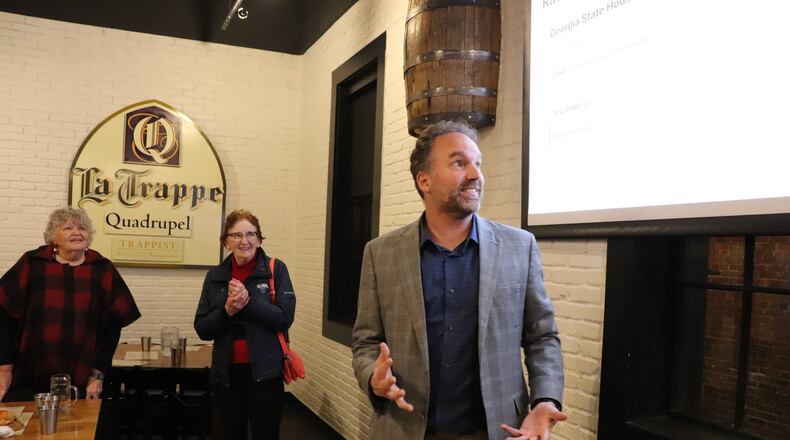 Democrat Eric Gisler talks to supporters about his election victory in a Georgia state House race on Tuesday, Dec. 9, 2025 at the Trappeze Pub in Athens, Ga.. (Christopher Dowd/Athens Political Nerd via AP)