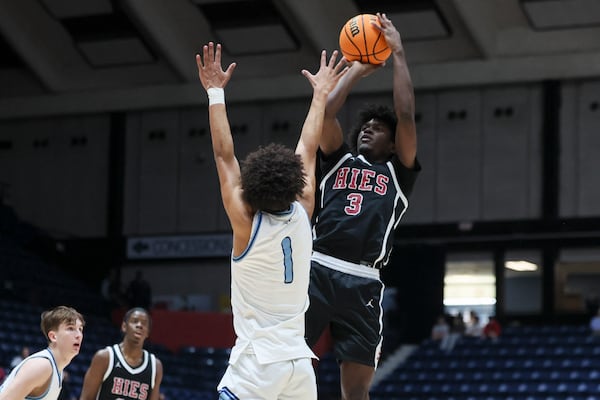 Holy Innocents’ guard Devin Hutcherson (3) attempts a shot against NC Christian guard Isaiah Chandler (1) in the the first half of the Private Boys GHSA State Championship at the Macon Centreplex, Wednesday, March, 5, 2025, in Macon, Ga. Holy Innocents’ won 84-45. (Jason Getz / AJC)