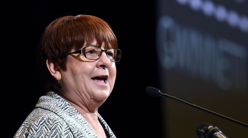 In her February 2016 “state of the county” speech, County Commission Chairman Charlotte Nash shows illustrations of Gwinnett’s future that include bus rapid transit, a kind of bus service that some see as an interim step toward rail transit.