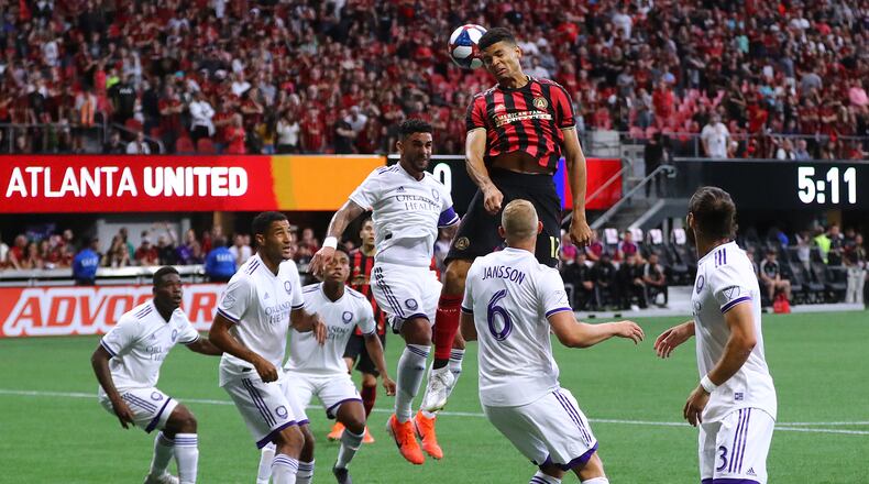 May 12, 2019 Atlanta: Atlanta United defender Miles Robinson trys to head a corner kick into the net against a host of Orlando City defenders during the first half in a MLS soccer match on Sunday, May 12, 2019, in Atlanta.  Curtis Compton/ccompton@ajc.com