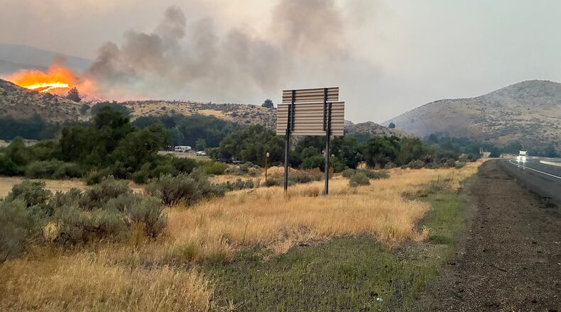 This undated photo provided by the Oregon Department of Transportation on Monday, July 27, 2026, shows the Fox Fire burning in eastern Oregon. (Oregon Department of Transportation via AP)