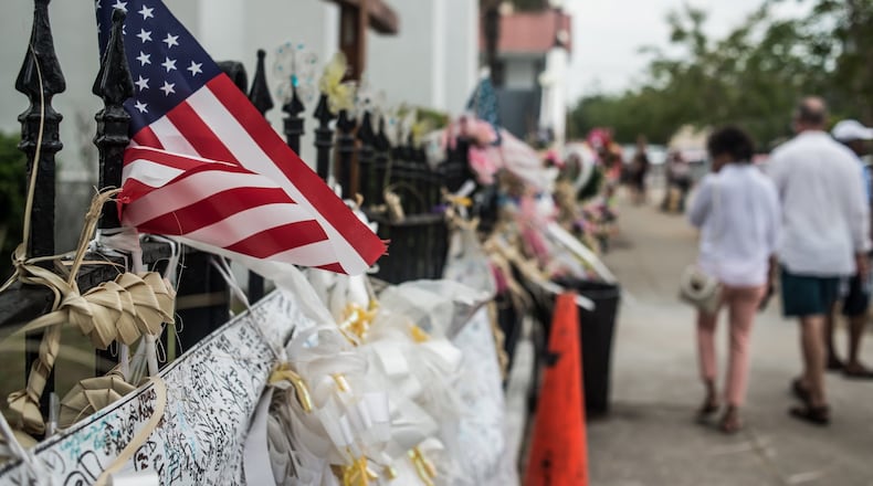 People walk past Emanuel AME Church on July 31, 2015, in Charleston, S.C., where Dylann Roof killed nine members in a Bible study class. SEAN RAYFORD / GETTY IMAGES