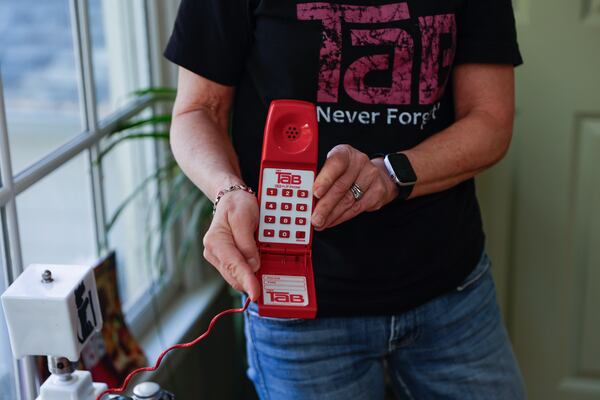 Jenny Boyter has a collection of Tab memorabilia, such as this vintage telephone. (Natrice Miller/AJC)
