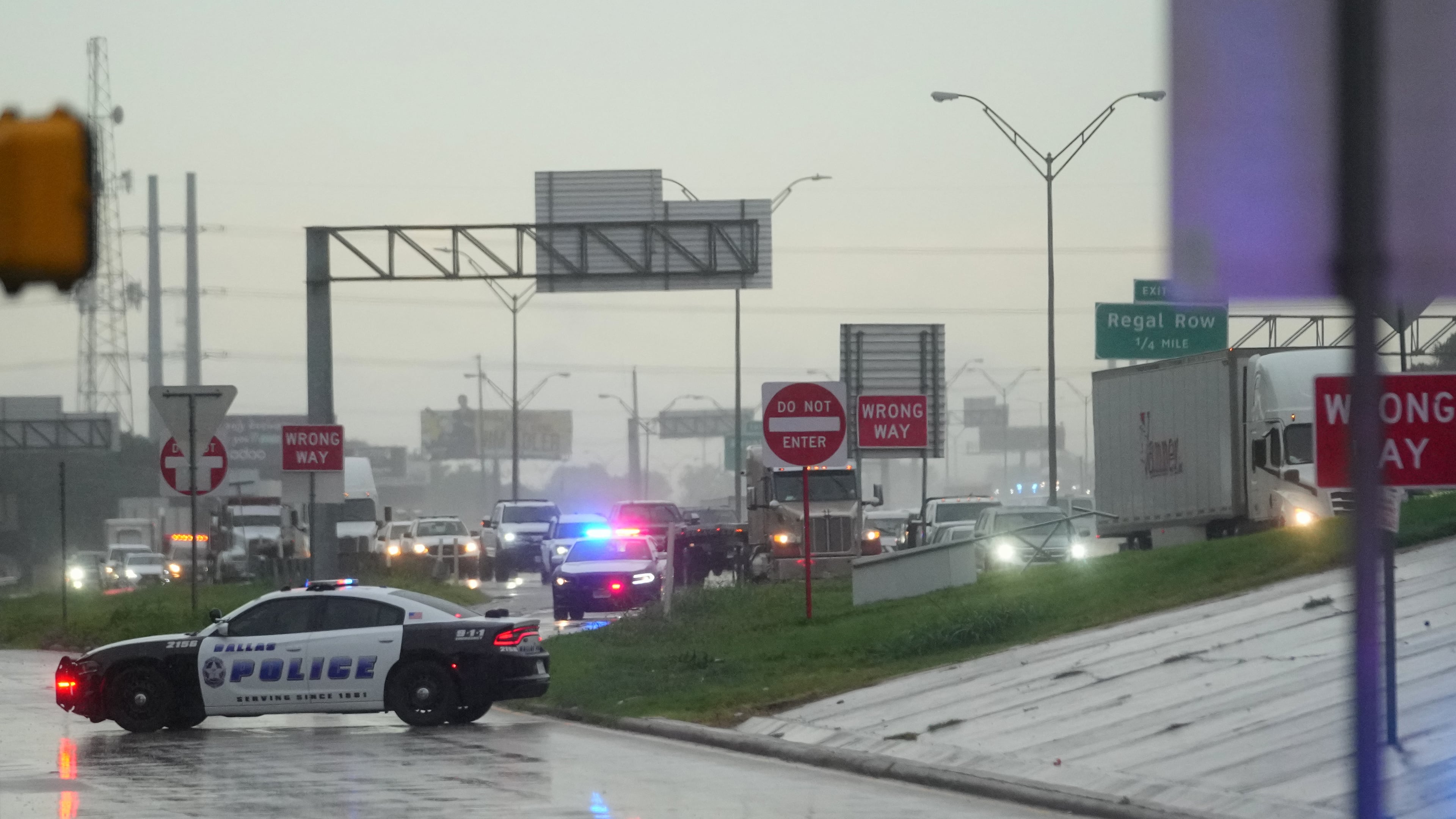 Police block off the street close to a U.S. Immigration and Customs Enforcement office after a reported shooting, in Dallas on Wednesday, Sept. 24, 2025. (AP Photo/Julio Cortez)