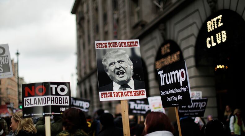 People hold placards at a March protest in London, in opposition to President Donald Trump's ban on travelers and immigrants from six predominantly Muslim countries. AP/Matt Dunham