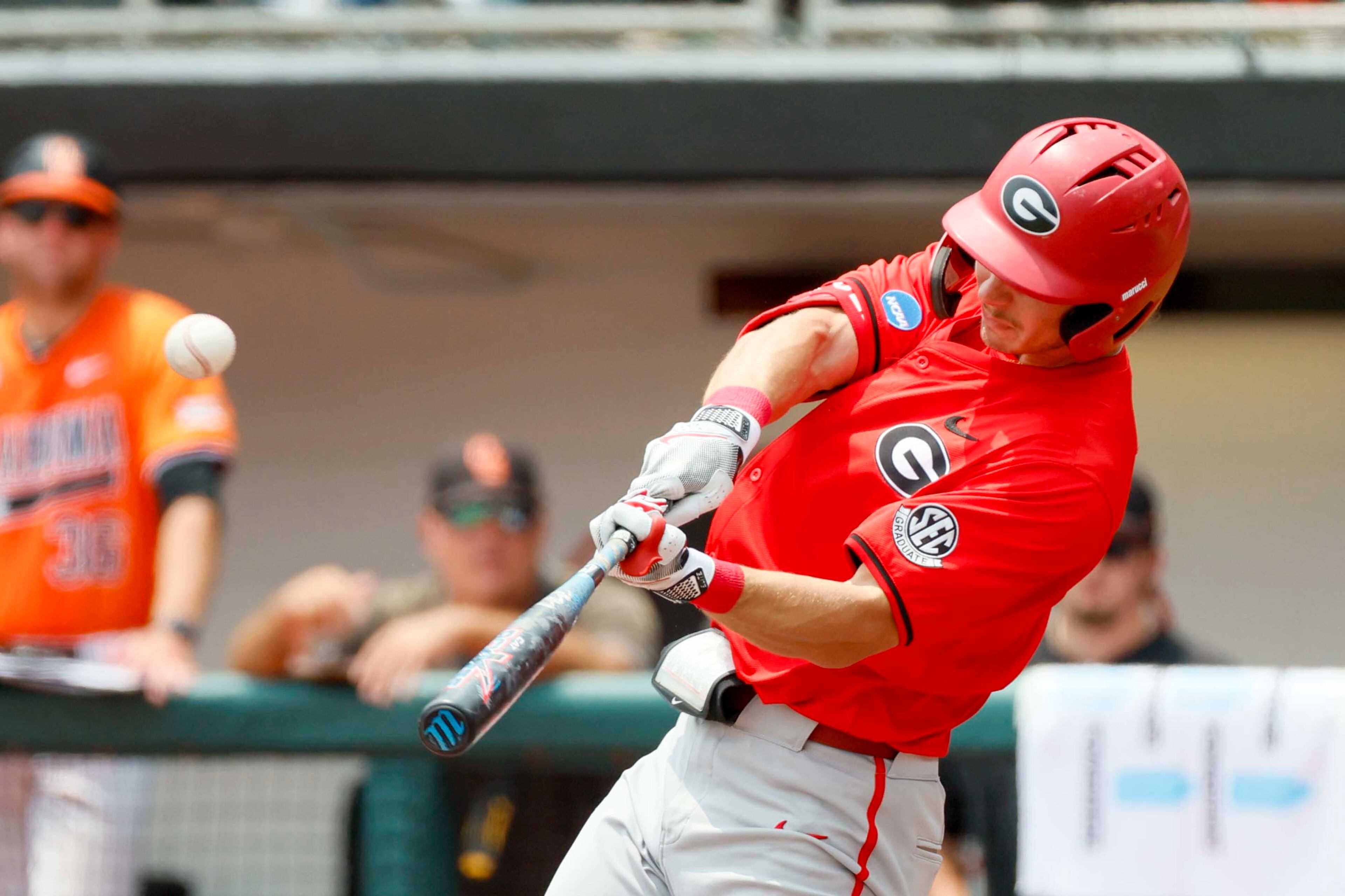 Georgia infielder Christian Adams (5) hits a two-run home run during the second inning against Oklahoma State in their NCAA Regional game at Foley Field,  Sunday, June 1, 2025, in Athens, Ga.
(Miguel Martinez/ AJC)