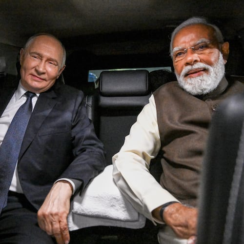 Russian President Vladimir Putin, and Indian Prime Minister Narendra Modi sit inside a limousine after arriving at the Palam Air Base in New Delhi, India, on Thursday, Dec. 4, 2025. (Grigory Sysoyev, Sputnik, Kremlin Pool Photo via AP)