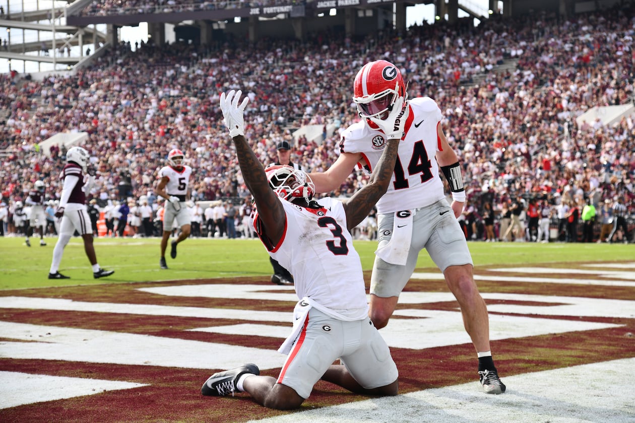 Georgia running back Nate Frazier (3) celebrates with Georgia quarterback Gunner Stockton (14) after scoring a touchdown during the second half in an NCAA football game at Davis Wade Stadium, Saturday, November 8, 2025, in Starkville, Mississippi. Georgia won 41-21 over Mississippi State. (Hyosub Shin / AJC)