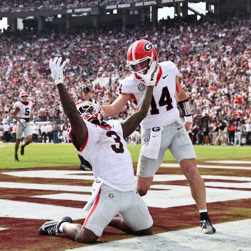 Georgia running back Nate Frazier (3) celebrates with Georgia quarterback Gunner Stockton (14) after scoring a touchdown during the second half in an NCAA football game at Davis Wade Stadium, Saturday, November 8, 2025, in Starkville, Mississippi. Georgia won 41-21 over Mississippi State. (Hyosub Shin / AJC)