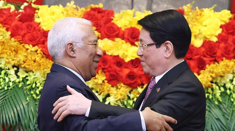 European Council President Antonio Costa, left, and Vietnamese President Luong Cuong hug after a press conference in Hanoi, Vietnam, Thursday, Jan. 29, 2026. (Bui Lam Khanh/VNA via AP)