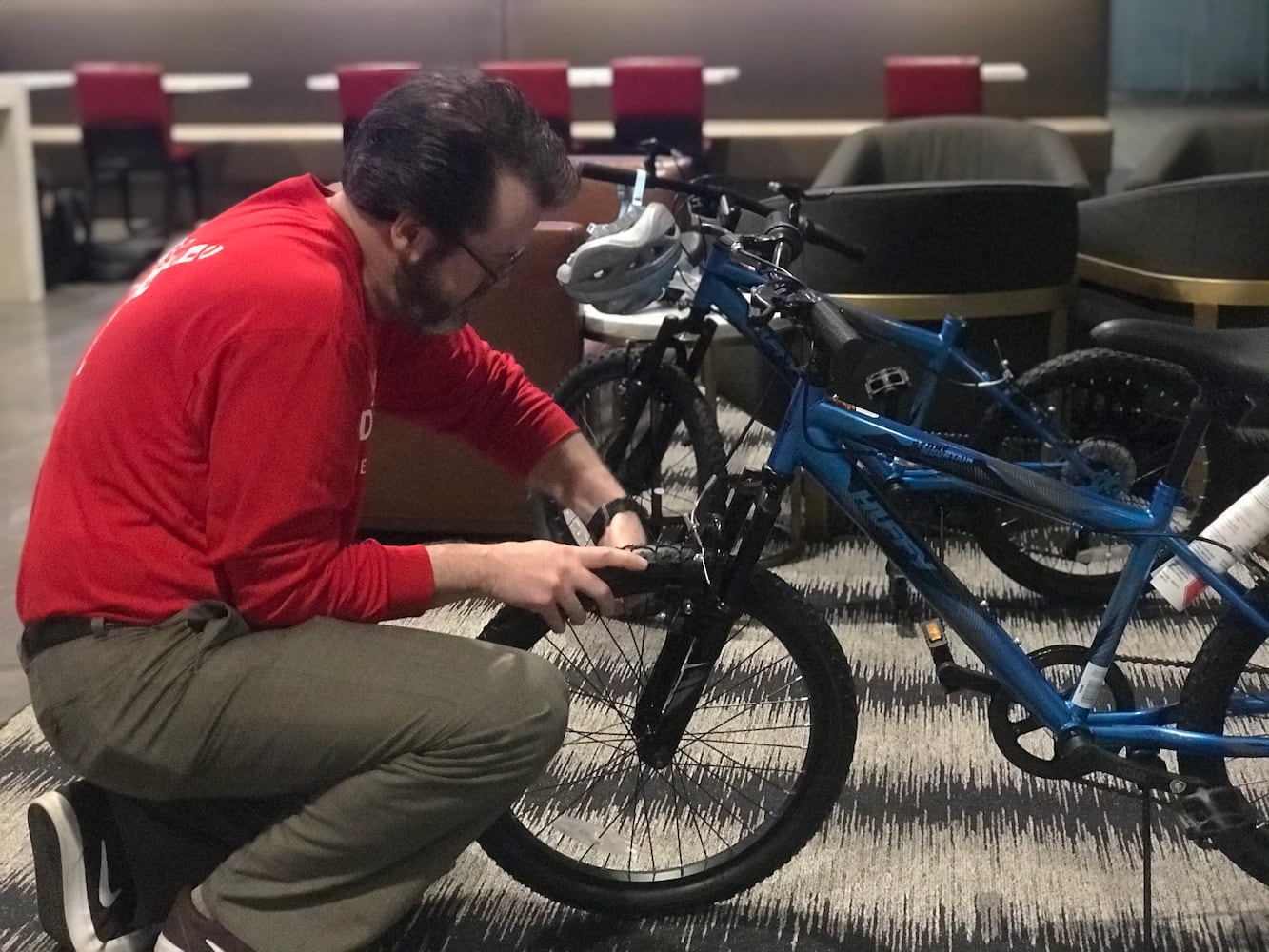 Delta volunteers assemble 100 bicycles to donate to kids