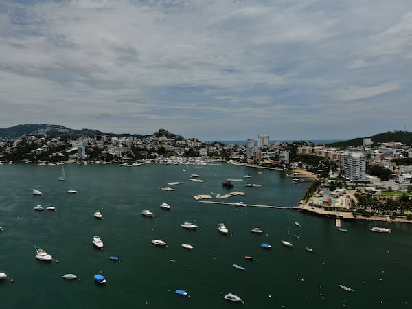 Boats are anchored near Manzanillo beach to be removed from the water ahead of the arrival of Hurricane Erick in Acapulco, Mexico, Wednesday, June 18, 2025. (AP Photo/Fernando Llano)