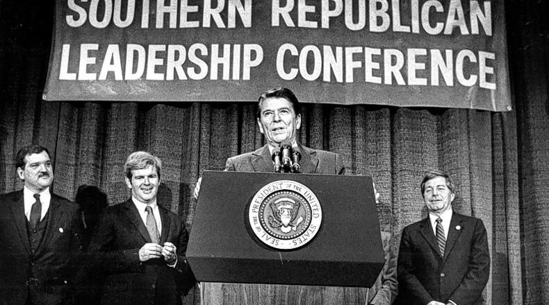 President Ronald Reagan, in 1984 in Atlanta, stood with Southern GOP Chairman Bill Harris (left), Newt Gingrich and Mack Mattingly as he promised a new "Solid South" for Republicans. (File)