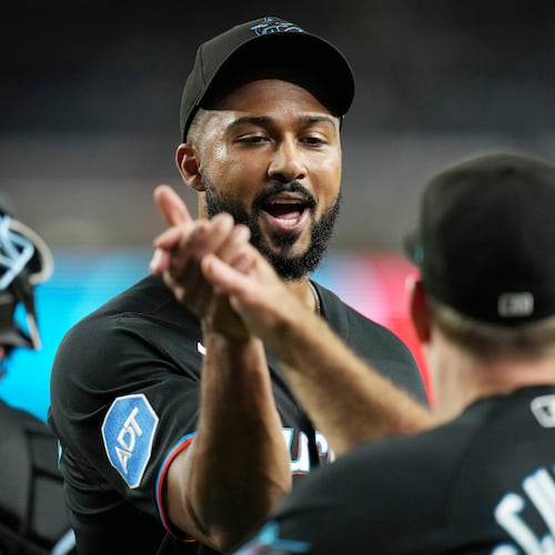 Miami Marlins pitcher Sandy Alcantara, left, celebrates a win against the Arizona Diamondbacks with Marlins manager Clayton McCullough after a baseball game, Wednesday, Sept. 16, 2026, in Phoenix. (AP Photo/Ross D. Franklin)
