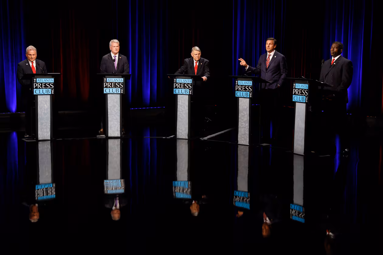 Former football coach Derek Dooley (second from the right), answers a question at the Atlanta Press Club Loudermilk-Young debate for the U.S. Senate on Sunday, April 26, 2026. (Miguel Martinez/AJC)