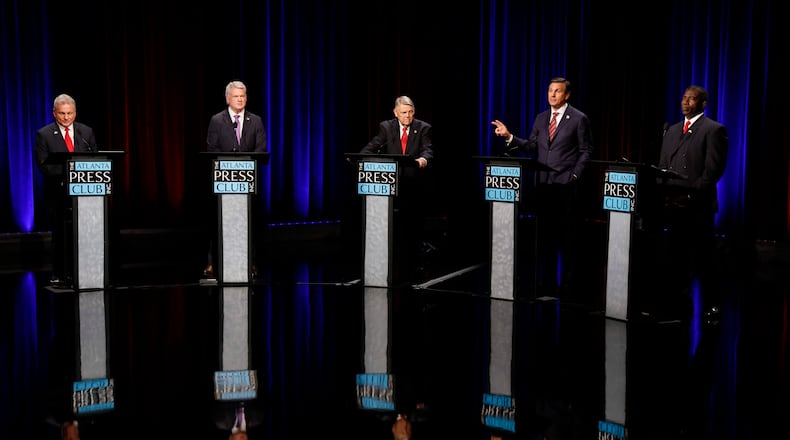 Former football coach Derek Dooley a Republican candidate for the U.S. Senate, second from the right, speaks at the Atlanta Press Club Loudermilk-Young debate for the U.S. Senate at Georgia Public Broadcasting in Midtown on Sunday, April 26, 2026.
(Miguel Martinez/AJC)