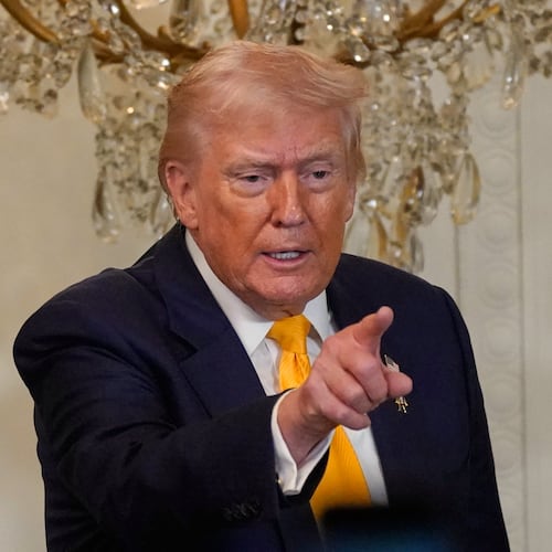 President Donald Trump gestures during a Black History Month event in the East Room of the White House, Wednesday, Feb. 18, 2026, in Washington. (AP Photo/Nathan Howard)