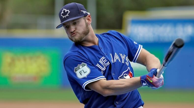 In this March 13, 2017, file photo, Toronto Blue Jays' Josh Donaldson takes practice swings before his turn in the batting cage before a spring training baseball game against the Boston Red Sox, in Dunedin, Fla. Donaldson is an early adopter to a growing big league trend — hitters fixated on producing fly balls. Or, as Donaldson put it recently on Twitter: "Just say NO.... to ground balls." (AP Photo/Chris O'Meara, File)