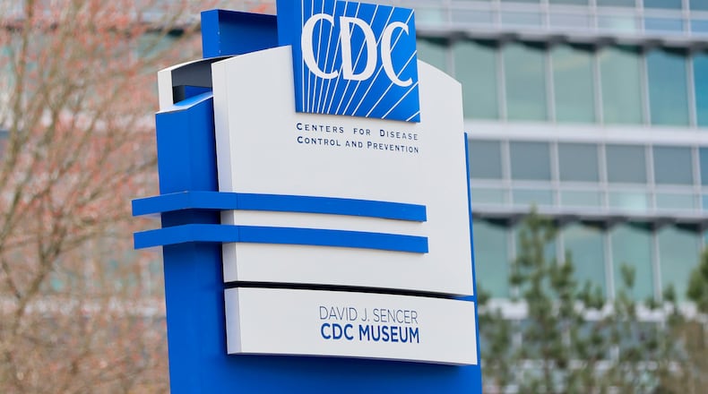 A sign with the CDC logo is displayed at the entrance to the agency's headquarters in Atlanta on March 2, 2025. (Miguel Martinez/AJC file)