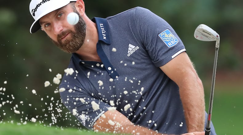 Dustin Johnson hits his sand shot to the 10th green during Tuesday's practice round at Augusta National.
