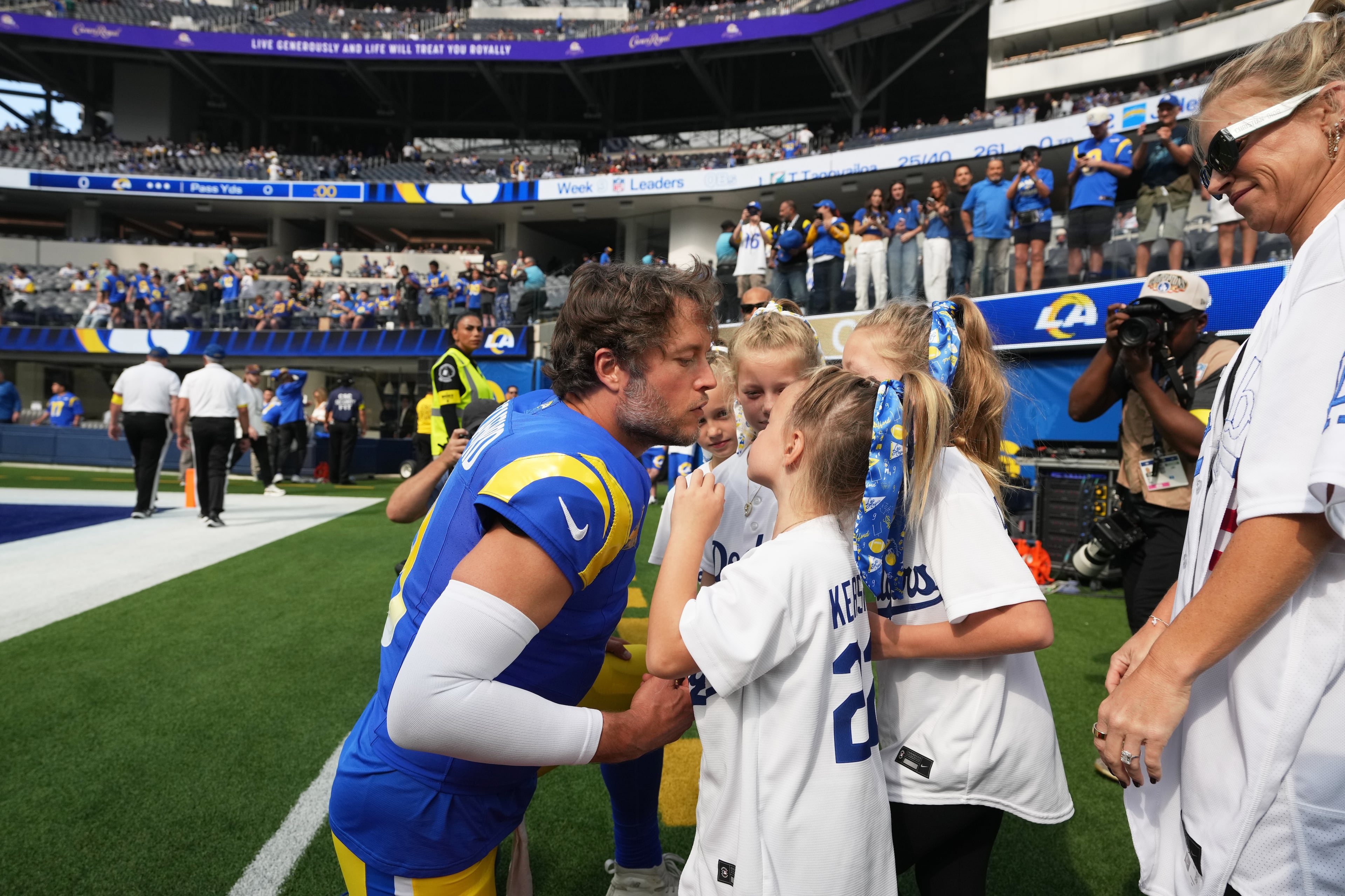 Los Angeles Rams quarterback Matthew Stafford greets family before an NFL football game against the New Orleans Saints Sunday, Nov. 2, 2025, in Inglewood, Calif. (Gregory Bull/AP)