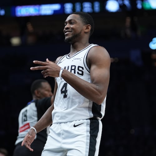 San Antonio Spurs guard De'aaron Fox (4) reacts after scoring against the Minnesota Timberwolves during the second half of Game 6 of an NBA basketball second-round playoffs series in Minneapolis, Friday, May 15, 2026. (AP Photo/Abbie Parr)