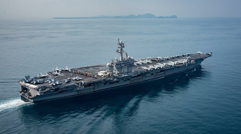 SUNDA STRAIT, INDONESIA - APRIL 14: In this handout provided by the U.S. Navy, the aircraft carrier USS Carl Vinson (CVN 70) transits the Sunda Strait on April 14, 2017 in Indonesia. The Carl Vinson Carrier Strike Group is on a scheduled western Pacific deployment as part of the U.S. Pacific Fleet-led initiative to extend the command and control functions of U.S. 3rd Fleet. U.S Navy aircraft carrier strike groups have patrolled the Indo-Asia-Pacific regularly and routinely for more than 70 years. (Photo by Mass Communication Specialist 2nd Class Sean M. Castellano / U.S. Navy via Getty Images)
