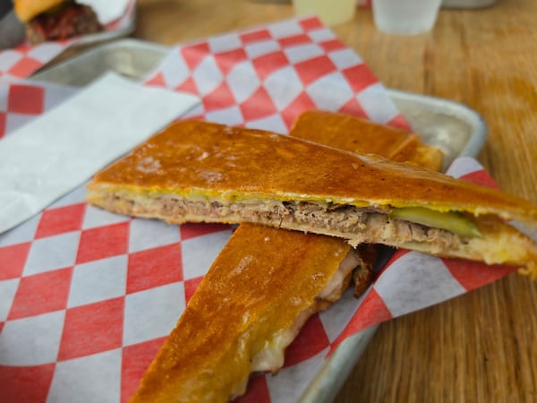 A thin-pressed, classic Cuban sandwich cut on the bias.
