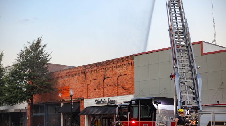 A Friday evening fire tore through several business in downtown Covington, officials said.